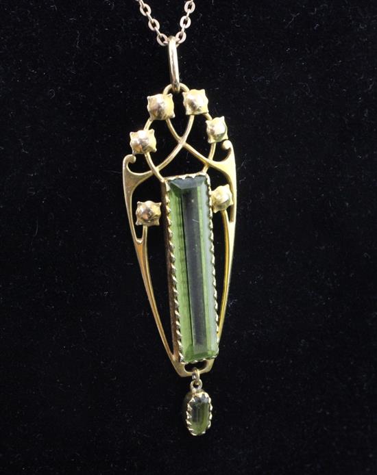 An Edwardian Art Nouveau Murrle Bennett & Co 15ct gold and peridot drop pendant, pendant 2in.
